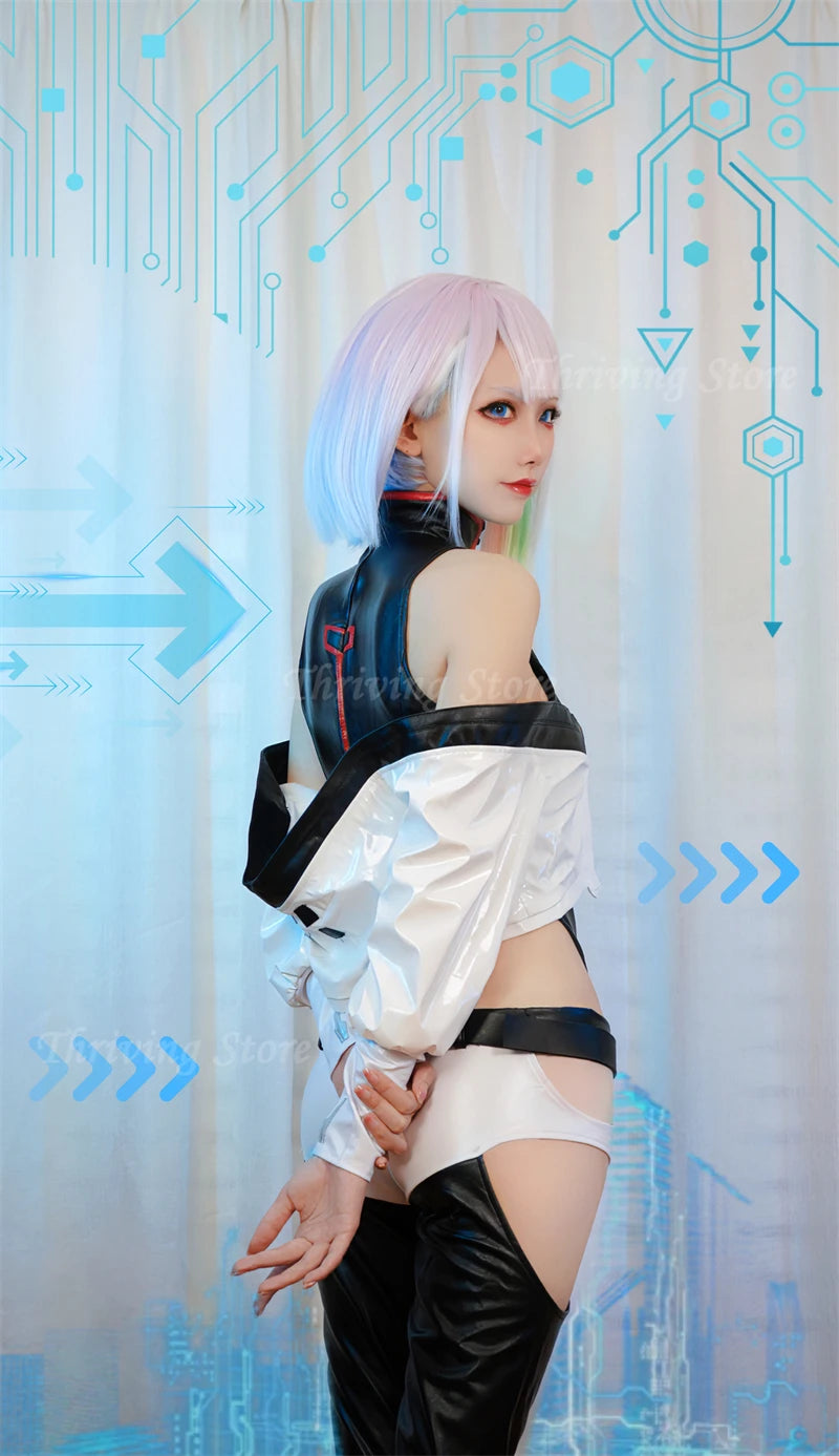 A cosplay model wearing a sci-fi cyborg-style outfit with a white and black asymmetrical top, thigh-high black boots, and a cybernetic shoulder piece, posed against a blue circuit-patterned backdrop.