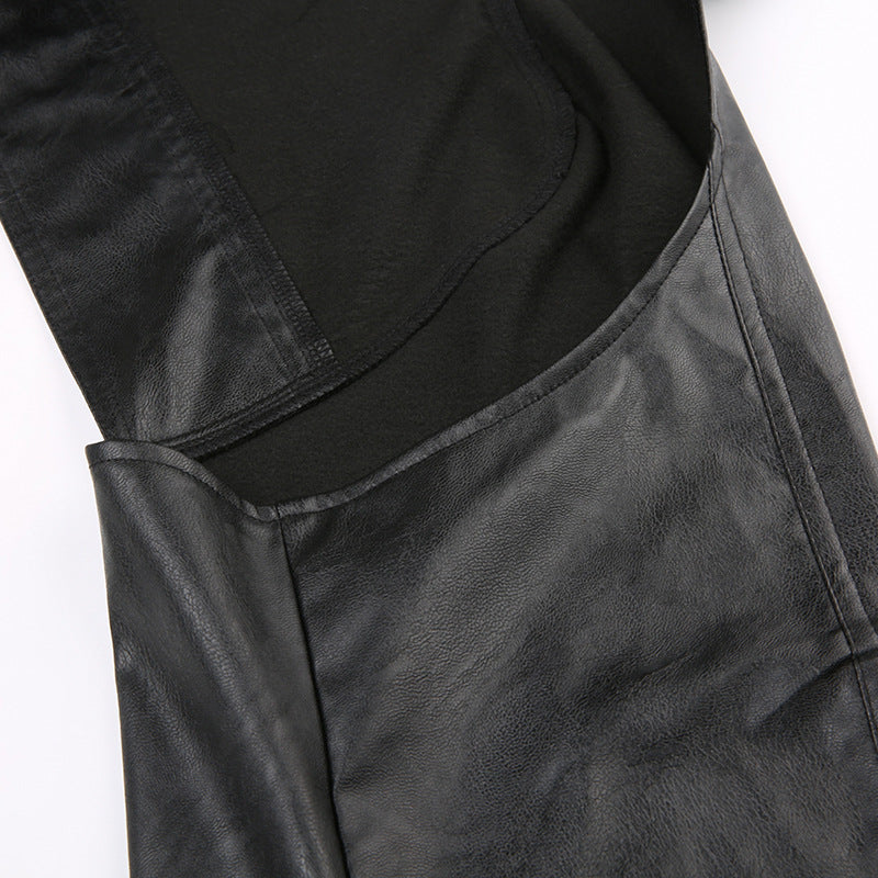 Close-up of a black leather jacket with a white background
