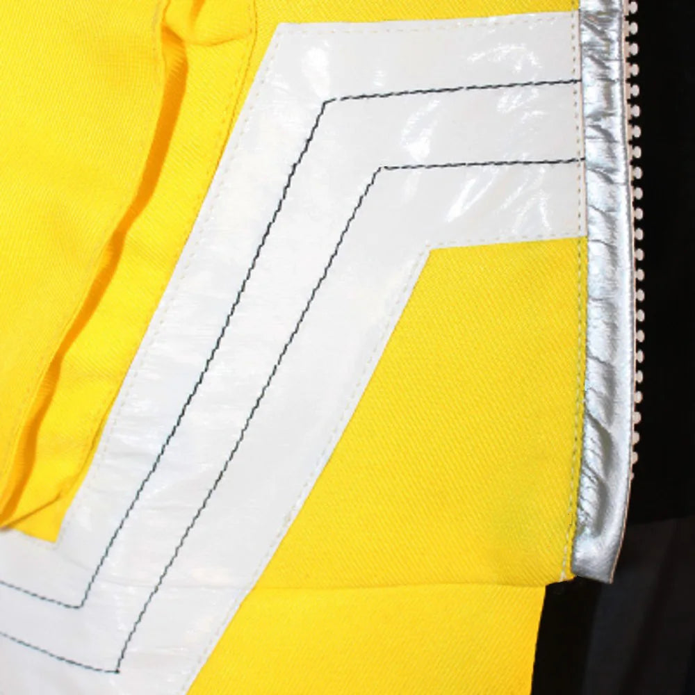 Close-up of a yellow fabric with white stitching detail
