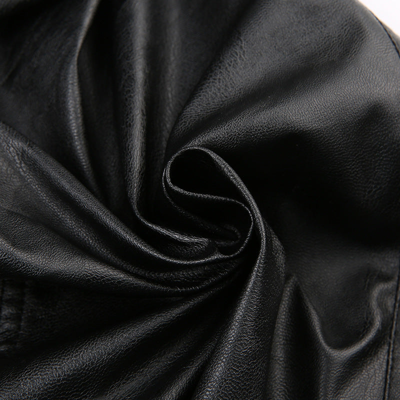 Close-up of black leather fabric with folds