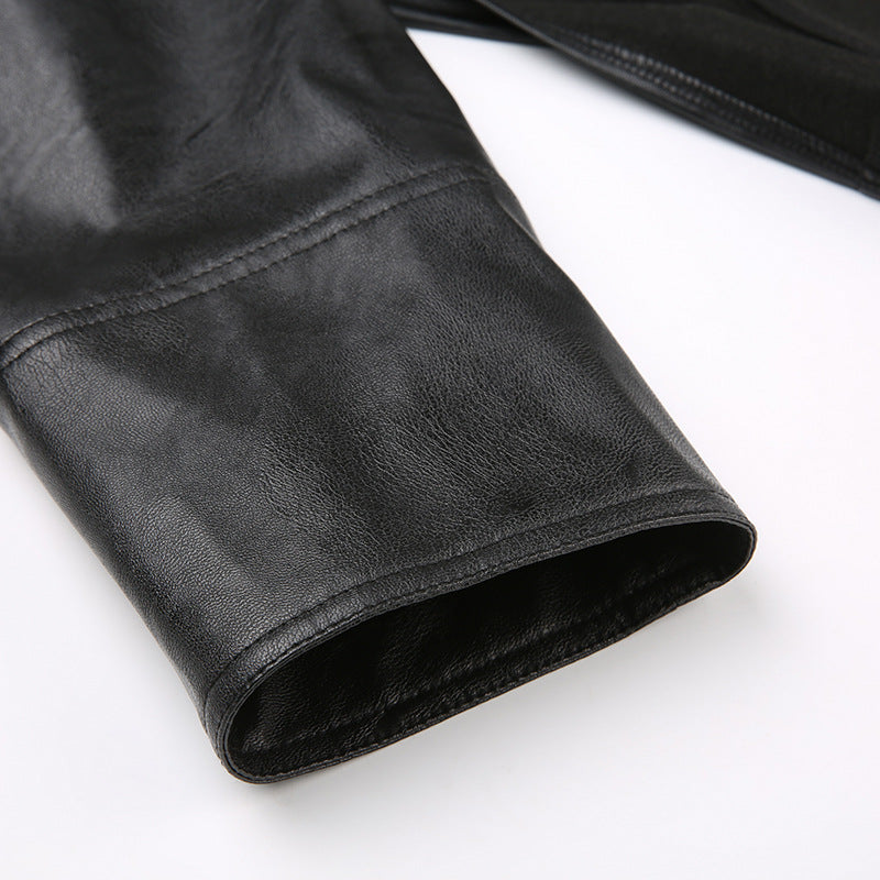 Close-up of black leather jacket on a white background