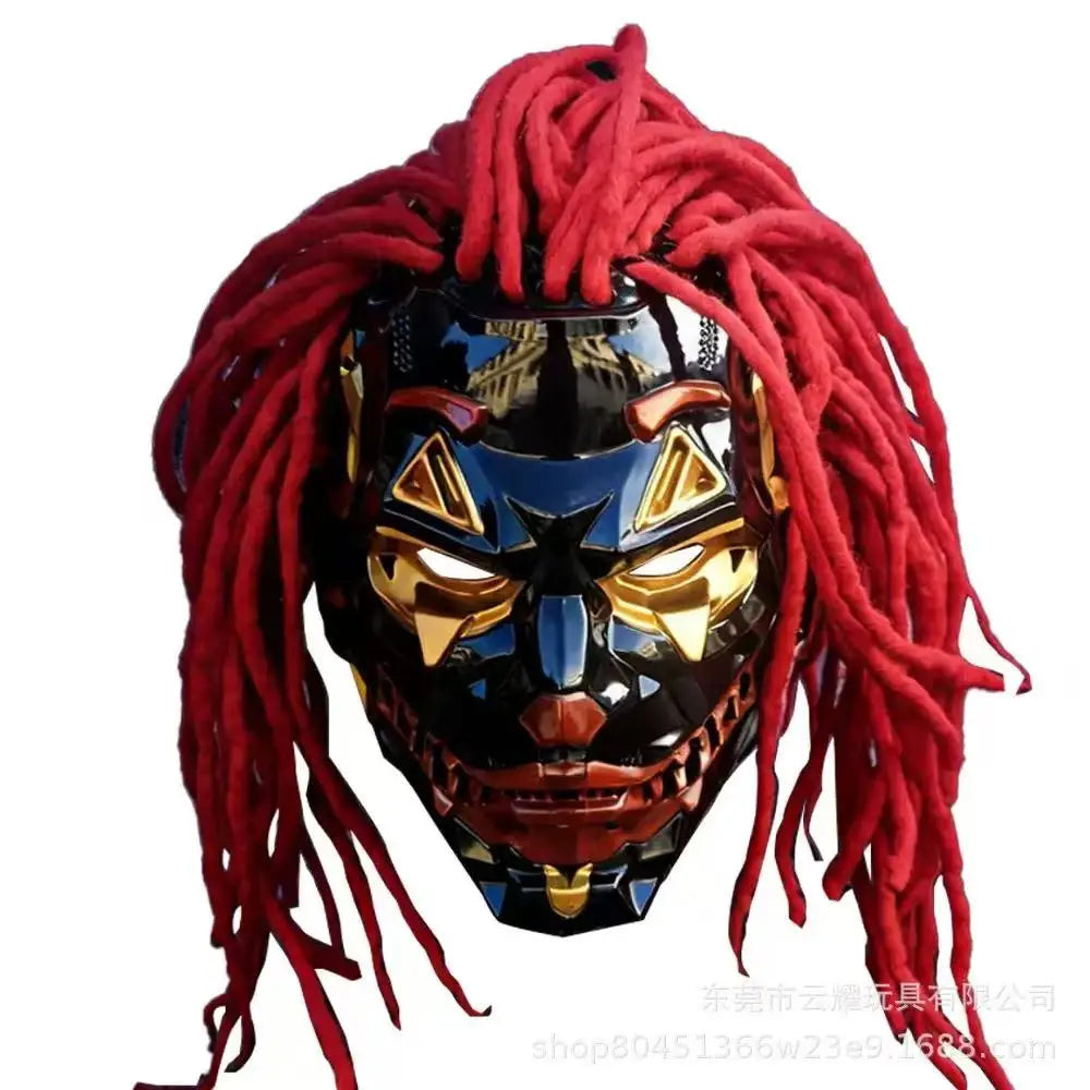 A stylized horror mask with long red dreadlock hair, a glossy black face, gold eye details, and a red mouth, shown against a plain white background.